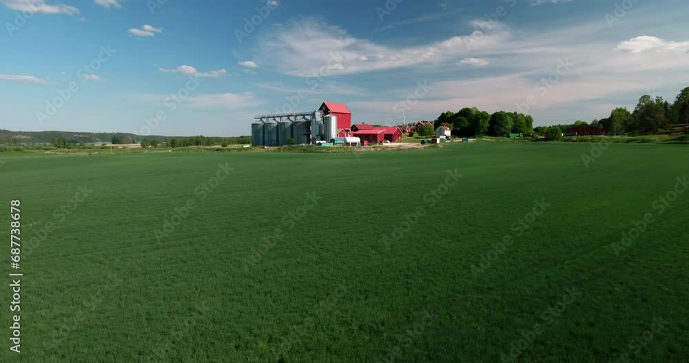 Aerial: Drone Panning Tranquil View Of Silos And Factory, Drone Flying Over Green Landscape On Sunny Day - Mariefred, Sweden Aerial: Drone Panning Tranquil View Of Silos And Factory, Drone Flying Over Green Landscape On Sunny Day - Mariefred, Sweden
