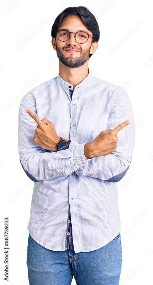 Handsome hispanic man wearing business shirt and glasses pointing to both sides with fingers, different direction disagree Handsome hispanic man wearing business shirt and glasses pointing to both sides with fingers, different direction disagree