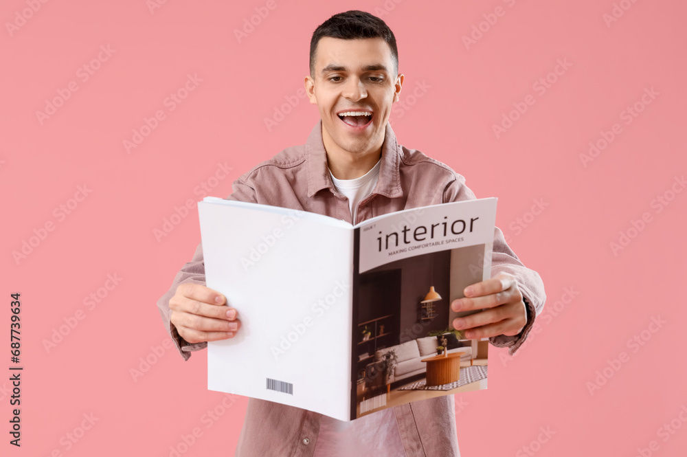 Happy young man with magazine on pink background Happy young man with magazine on pink background