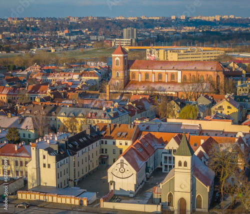 Aerial view of Kaunas old town in winter. Drone view of city center with churches, city hall and many historic red roof buildings