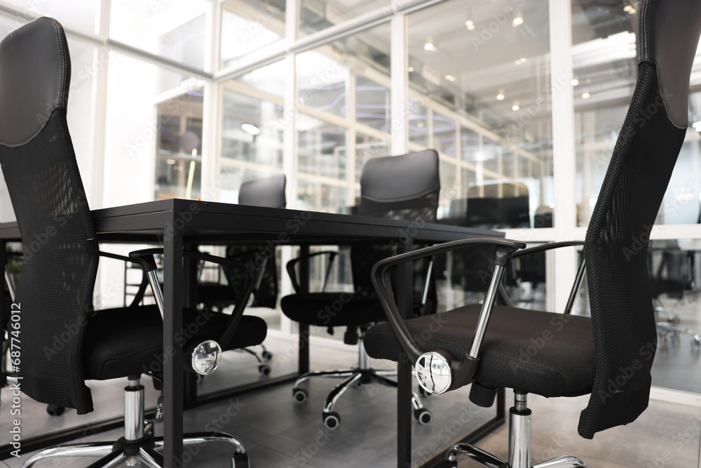 Comfortable office chairs and tables in meeting room