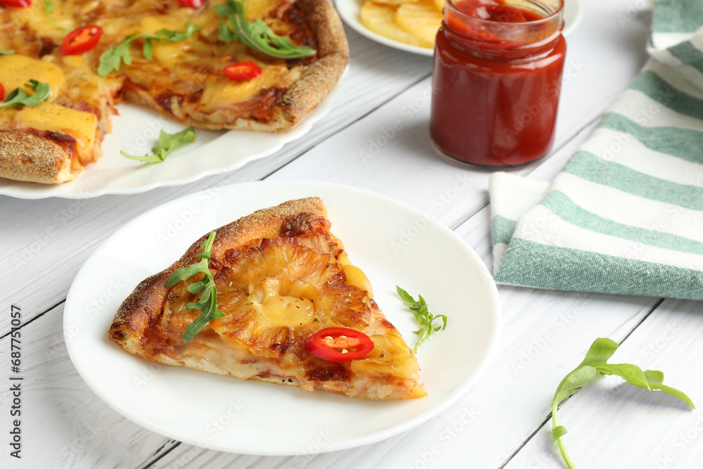 Plate with piece of delicious pineapple pizza on white wooden table Plate with piece of delicious pineapple pizza on white wooden table