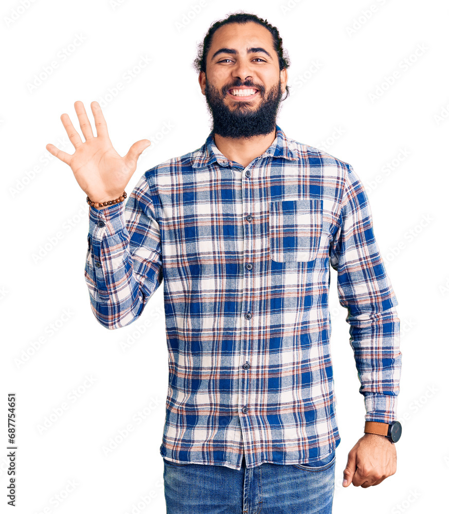 Young arab man wearing casual clothes showing and pointing up with fingers number five while smiling confident and happy. Young arab man wearing casual clothes showing and pointing up with fingers number five while smiling confident and happy.