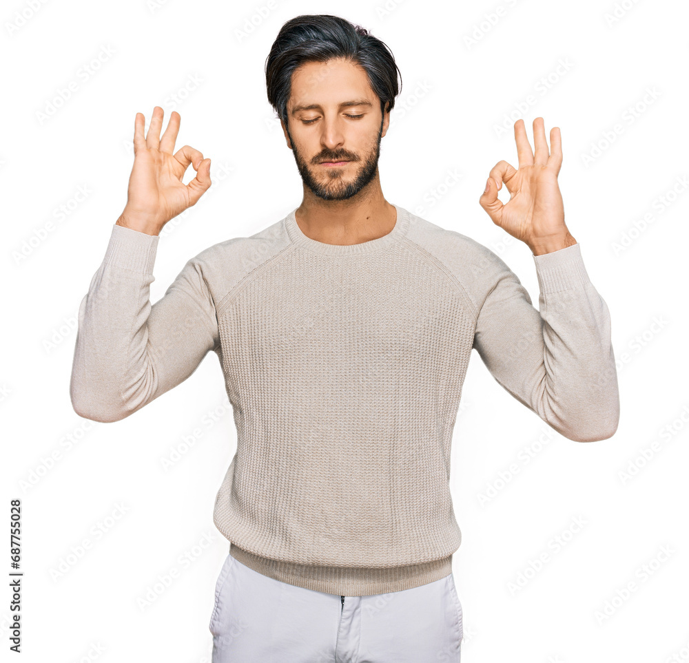 Naklejka premium Young hispanic man wearing casual clothes relax and smiling with eyes closed doing meditation gesture with fingers. yoga concept.