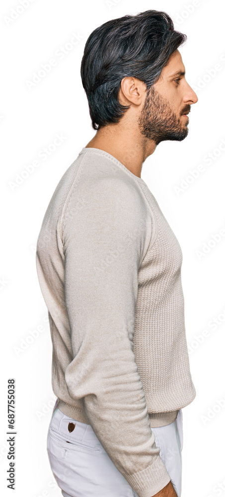 Young hispanic man wearing casual clothes looking to side, relax profile pose with natural face with confident smile. Young hispanic man wearing casual clothes looking to side, relax profile pose with natural face with confident smile.