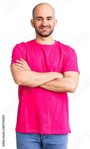 Young handsome man wearing casual t shirt happy face smiling with crossed arms looking at the camera. positive person.