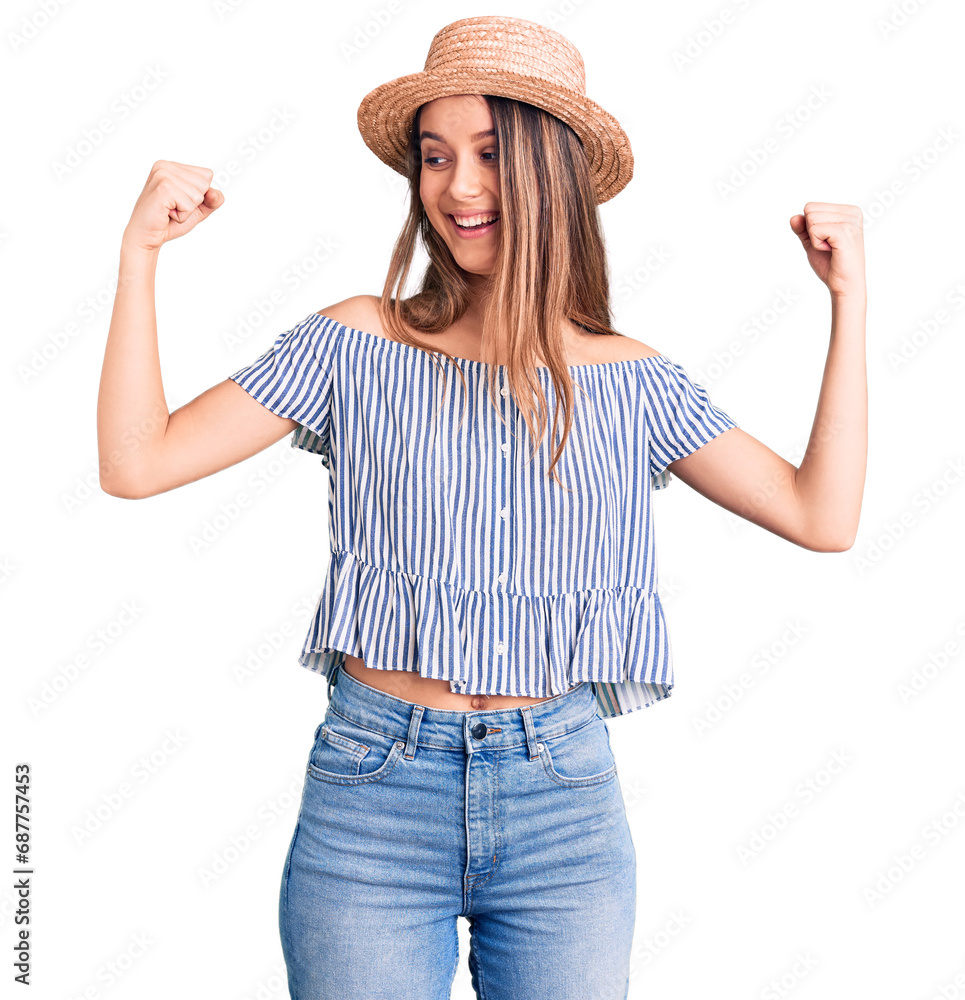 Young beautiful girl wearing hat and t shirt showing arms muscles smiling proud. fitness concept. Young beautiful girl wearing hat and t shirt showing arms muscles smiling proud. fitness concept.
