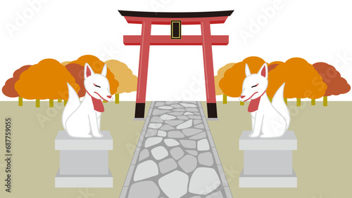 神社の鳥居とお稲荷様の石像がある秋の風景