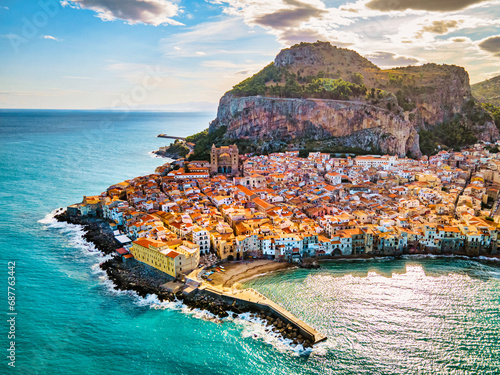 Drone view from above at the old town of Cefalu at sunset, medieval village of Sicily island, Province of Palermo, Italy. Europe. Cathedral of Cefalu photo
