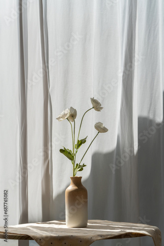 Still life of flowers in a glass on table