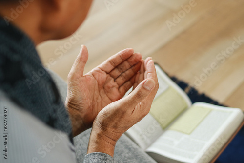 Wallpaper Mural Religious muslim man praying with holy book of Al Quran or Koran  Torontodigital.ca