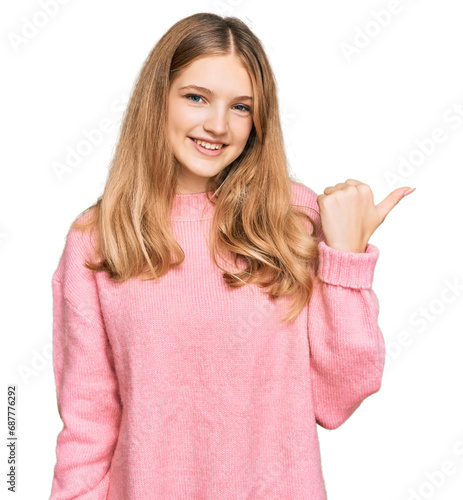 Wallpaper Mural Beautiful young caucasian girl wearing casual winter sweater smiling with happy face looking and pointing to the side with thumb up. Torontodigital.ca