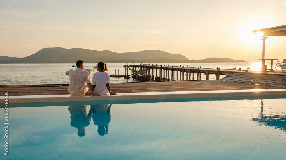 Fototapeta premium Wooden pier in the ocean during sunset in Samaesan Thailand