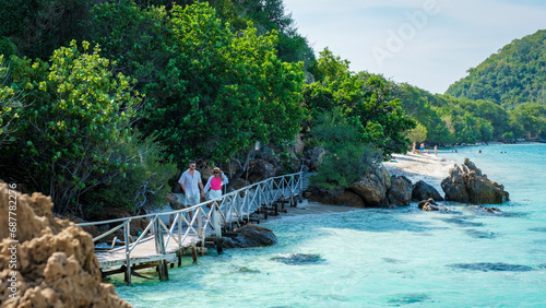 A couple of men and woman at Ko Kham tropical Island Sattahip Chonburi Samaesan Thailand