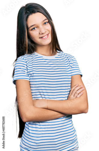 Young brunette girl with long hair wearing casual striped t shirt happy face smiling with crossed arms looking at the camera. positive person. © Krakenimages.com