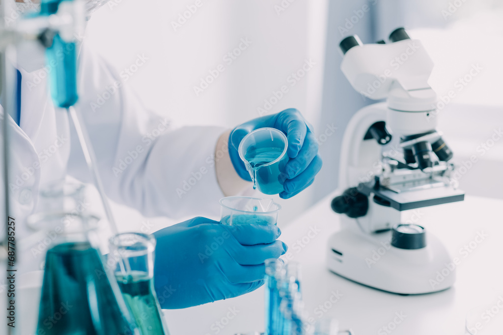microscope with lab glassware, science laboratory research and development concept microscope with lab glassware, science laboratory research and development concept
