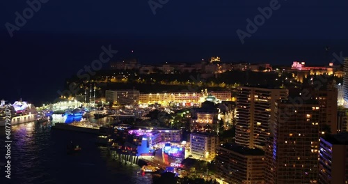 Wallpaper Mural Aerial Panning Shot Of Illuminated Residential Buildings In City, Drone Flying Over Sea At Night - Monte Carlo, Monaco Torontodigital.ca
