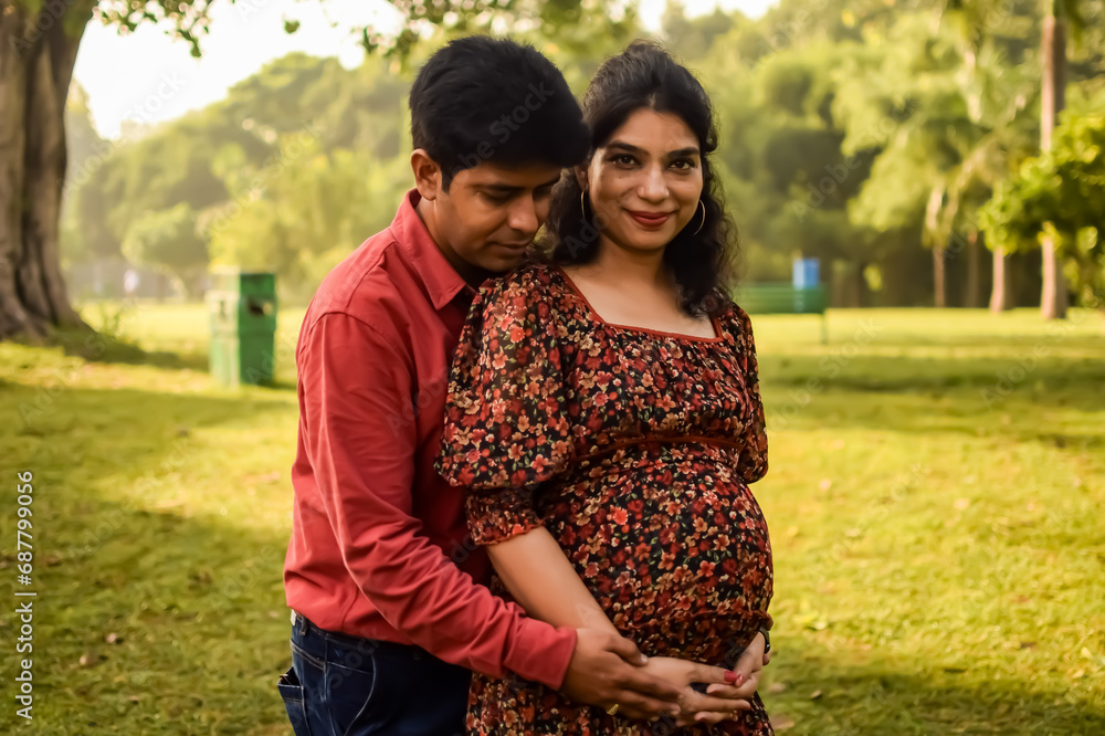 Indian couple posing for Maternity shoot pose for new born
