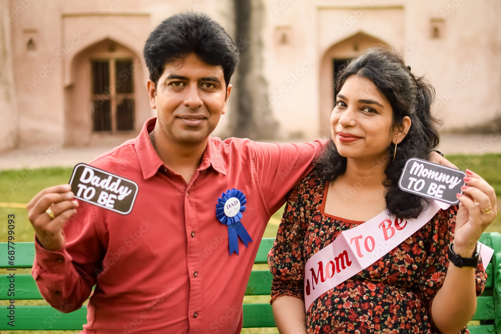 Indian couple posing for Maternity shoot pose for new born