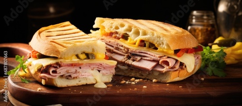 Hearty homemade Cuban pork sandwich with ham, cheese, and mustard. photo