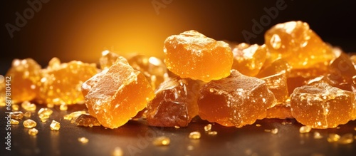 Golden caramelized candy with a crispy texture. photo