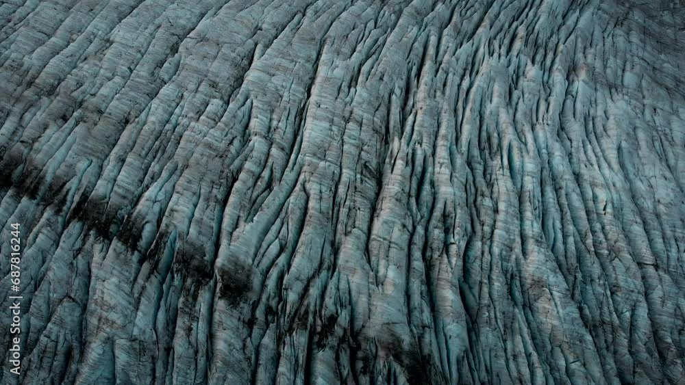Aerial view of the Gauli glacier in the Bernese Oberland region of the Swiss Alps with a panning overhead view over the ice and crevasses. Aerial view of the Gauli glacier in the Bernese Oberland region of the Swiss Alps with a panning overhead view over the ice and crevasses.