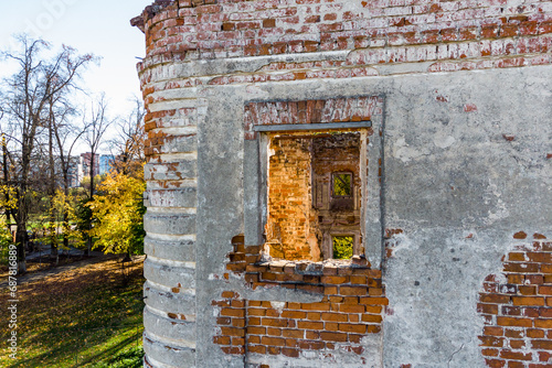 Exterior view through the second floor window of an old brick house. Belkino Estate, Obninsk, Russia
