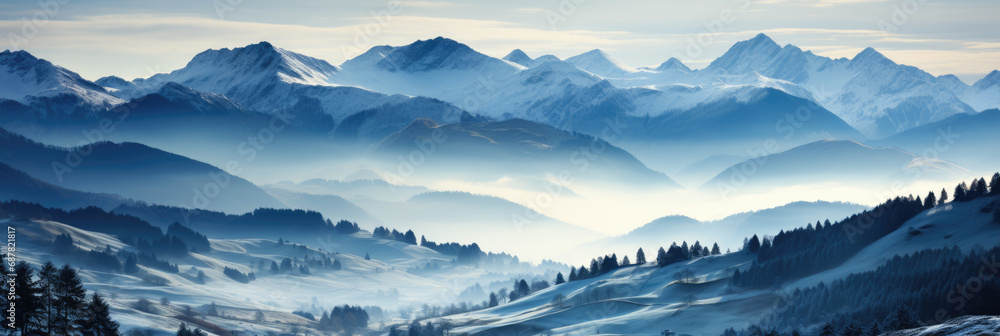 Vast panoramic image of a majestic snow-covered mountain range with snow-covered landscape in the foreground Vast panoramic image of a majestic snow-covered mountain range with snow-covered landscape in the foreground