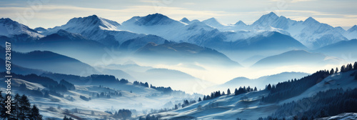 Vast panoramic image of a majestic snow-covered mountain range with snow-covered landscape in the foreground