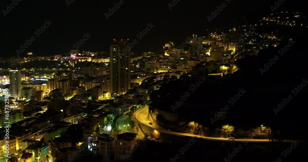 Aerial Panning Shot Of Illuminated Houses And Buildings In City At Night - Monte Carlo, Monaco Aerial Panning Shot Of Illuminated Houses And Buildings In City At Night - Monte Carlo, Monaco