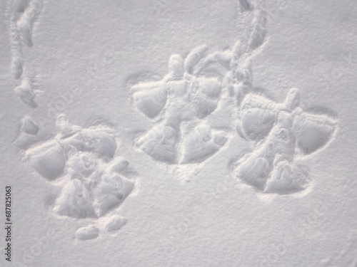 Three snow angels, top down aerial view