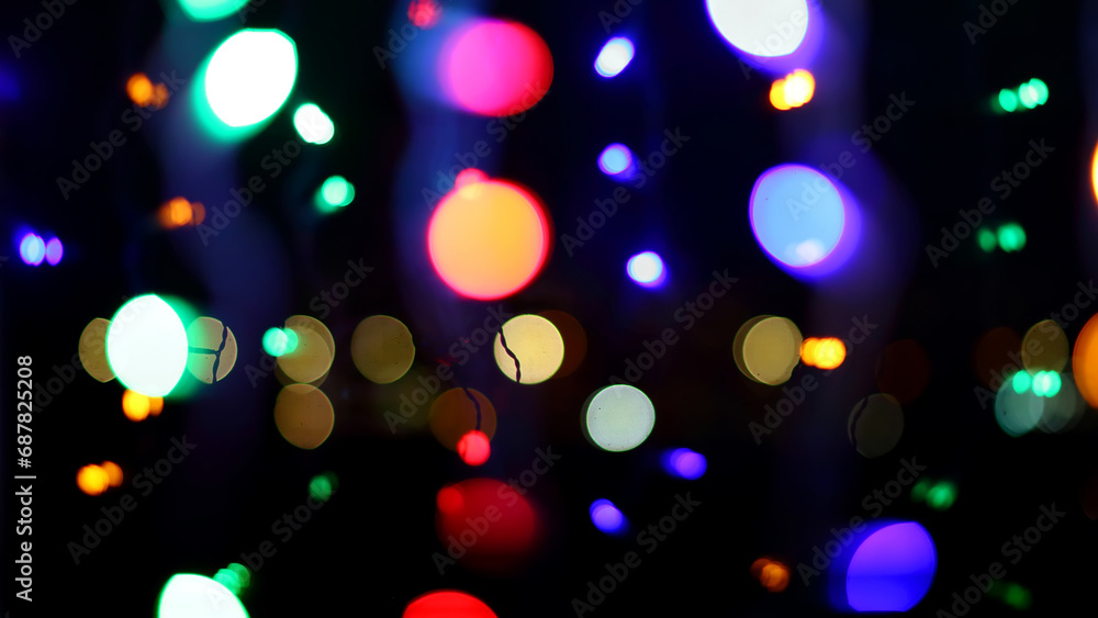 Christmas lights. Lights of Christmas tree garland in defocus. Christmas tree lights.