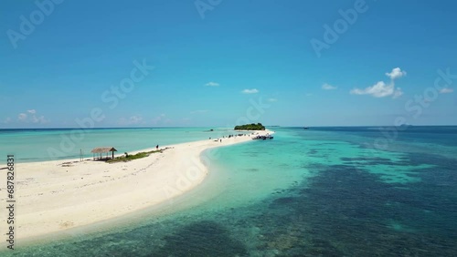 bounty island in Malaysia, low flying aerial, azure blue sea, sunny white sand beach photo