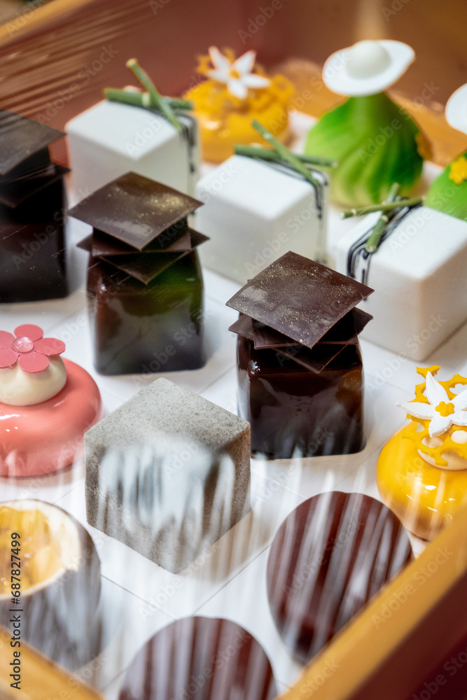 Assorted variety of petite gateau. Fine french desserts on a tray. Assorted variety of petite gateau. Fine french desserts on a tray.