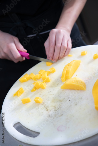 Baking of petite gateau in dessert kitchen. Bright kitchen environment. Pastry chef making finely crafted dessert. Human hand at work. photo