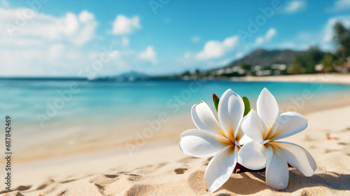 White plumeria flowers on a sandy beach with the sea in the background. AI Generative