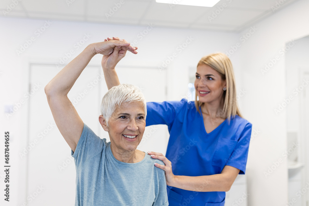 Physiotherapist woman giving exercise with dumbbell treatment About Arm and Shoulder of senior female patient Physical therapy concept Physiotherapist woman giving exercise with dumbbell treatment About Arm and Shoulder of senior female patient Physical therapy concept