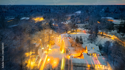 Winter Forest speed Aerial with lights , houses in Sachsenwald germany  photo