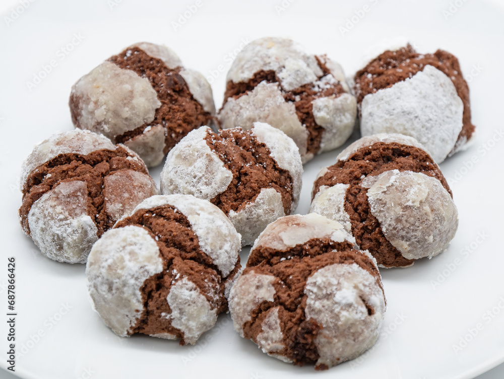 Cracked chocolate cookies with layer of whit sugar on the topa Cracked chocolate cookies with layer of whit sugar on the topa
