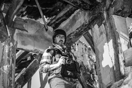 Photojournalist documenting war conflict. in the mountains. concept of war  military  technology and journalistic work. 