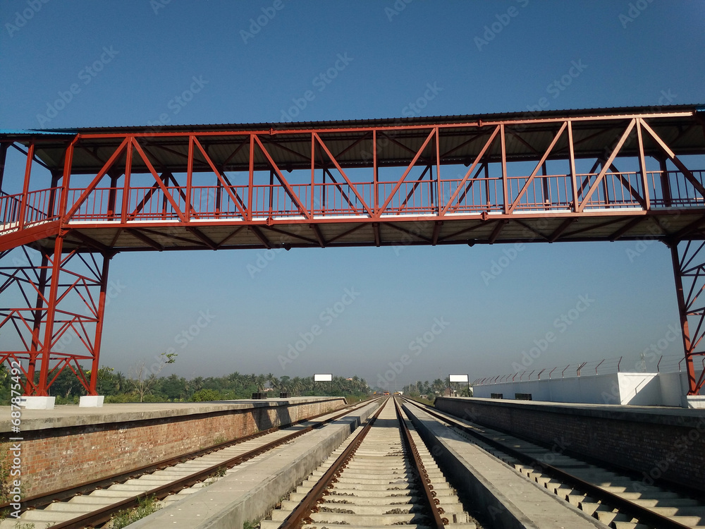 Fototapeta premium Metallic footover bridge at railway station