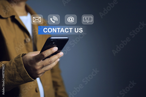 Contact us concept with man using smart phone to contact by email, call, and direct message to services team for help or question technical problem about products and services