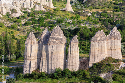 Weathered stone pillars of bizarre shape in the Love Valley near Goreme. Magnificent landscape of Cappadocia. Asia Minor, Turkey (Turkiye)