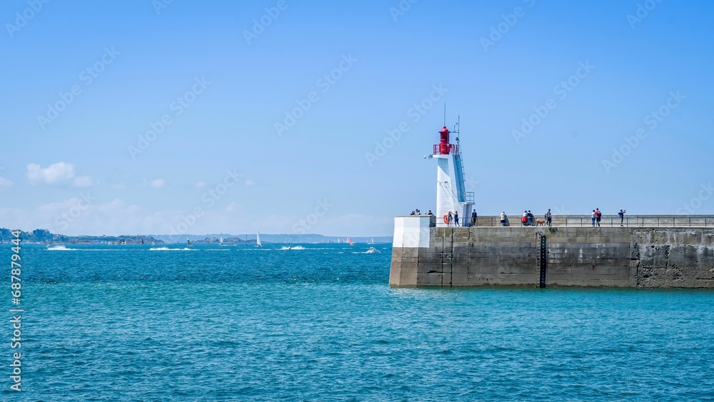 Picturesque lighthouse stands tall amidst a pristine ocean landscape in Saint-Malo, France