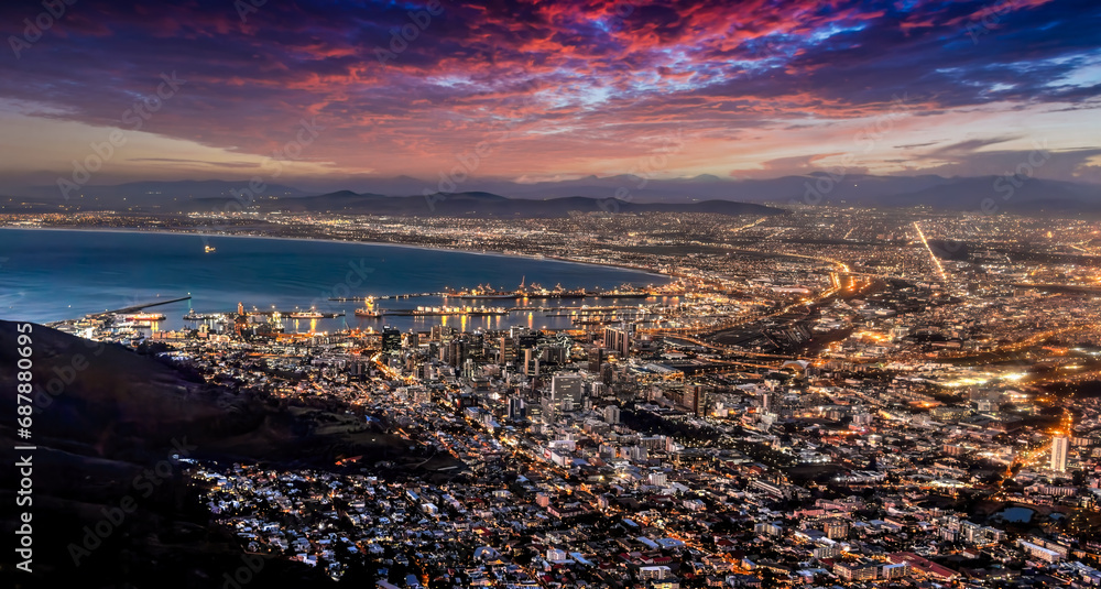 Naklejka premium aerial view night Cape town, waterfront and the ocean, city lights are on