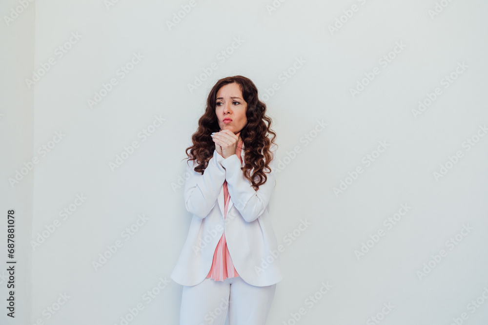 Beautiful brunette woman in white suit posing in bright studio Beautiful brunette woman in white suit posing in bright studio