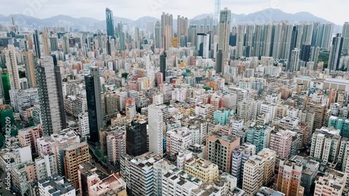Urban Buildings of Hong Kong City as Big Asia Metropolis on Victoria Island. Cityscape Concept of Over Populated Old Town in China. High Panoramic View on Famous Kowloon Area in Traditional HK Center photo