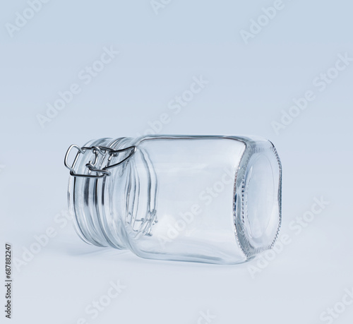 Empty clip-top glass jar lying on a side
