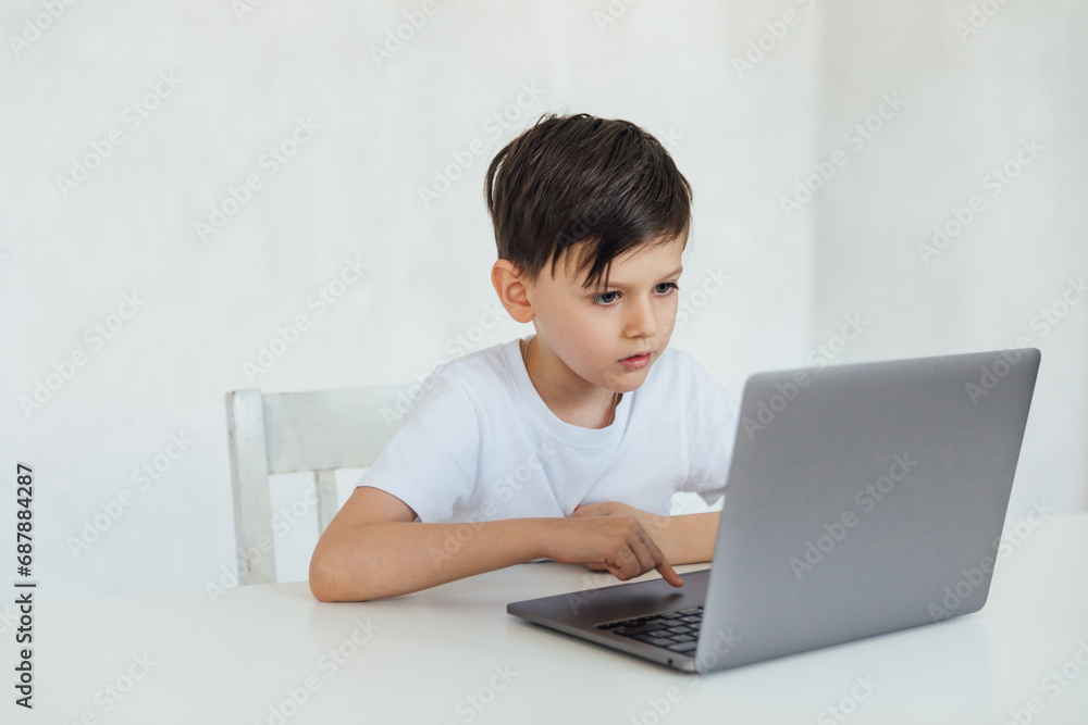 homeschooling student education lessons boy schoolboy learns at the computer online school in the classroom homeschooling student education lessons boy schoolboy learns at the computer online school in the classroom