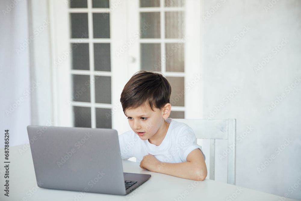 online school in the classroom homeschooling student education lessons boy schoolboy learns at the computer online school in the classroom homeschooling student education lessons boy schoolboy learns at the computer